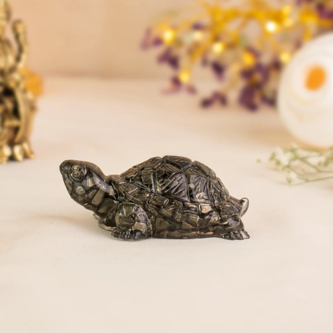 Vastu pyrite tortoise for wealth and stability - AstroGuruji